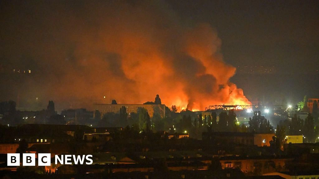 Russian ballistic missile strike on Kyiv kills two and injures others, officials say